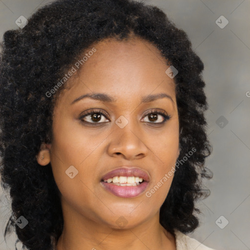 Joyful black young-adult female with long  brown hair and brown eyes