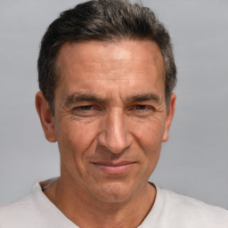 Joyful white middle-aged male with short  brown hair and brown eyes