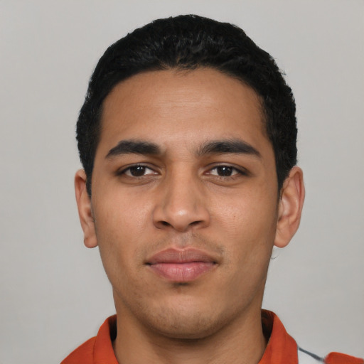 Neutral latino young-adult male with short  black hair and brown eyes