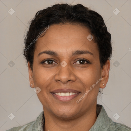 Joyful latino adult female with short  brown hair and brown eyes