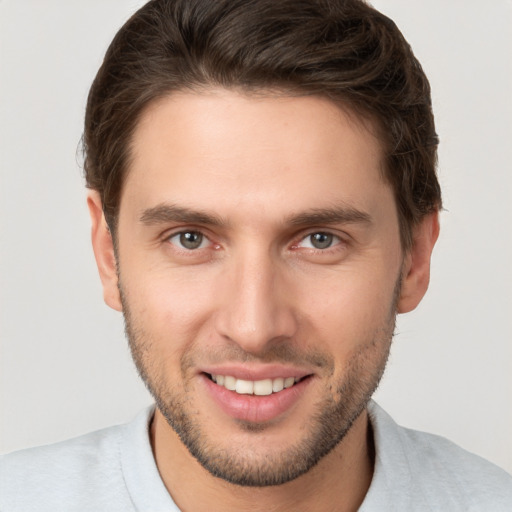 Joyful white young-adult male with short  brown hair and brown eyes