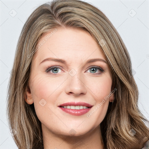 Joyful white young-adult female with long  brown hair and green eyes