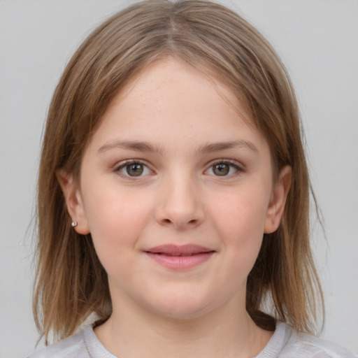 Joyful white child female with medium  brown hair and grey eyes