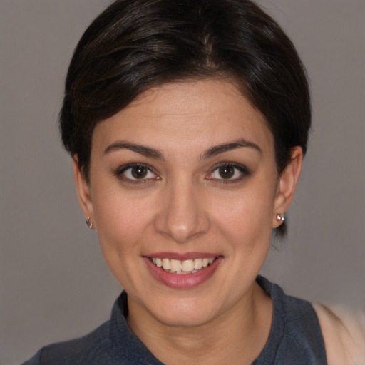 Joyful white young-adult female with medium  brown hair and brown eyes