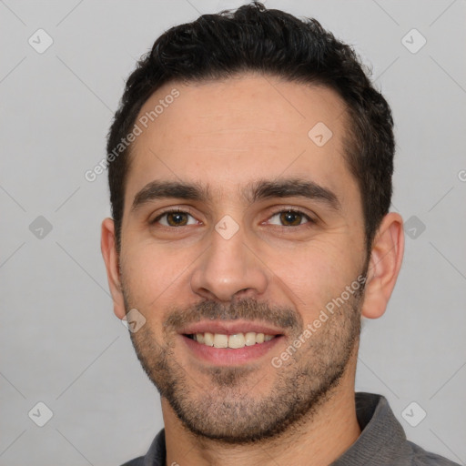 Joyful white young-adult male with short  black hair and brown eyes