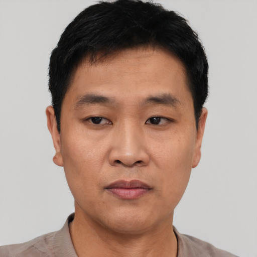 Neutral asian young-adult male with short  black hair and brown eyes