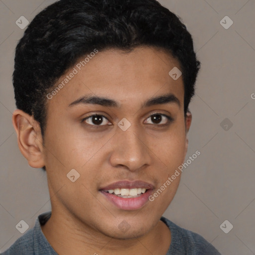 Joyful latino young-adult male with short  brown hair and brown eyes