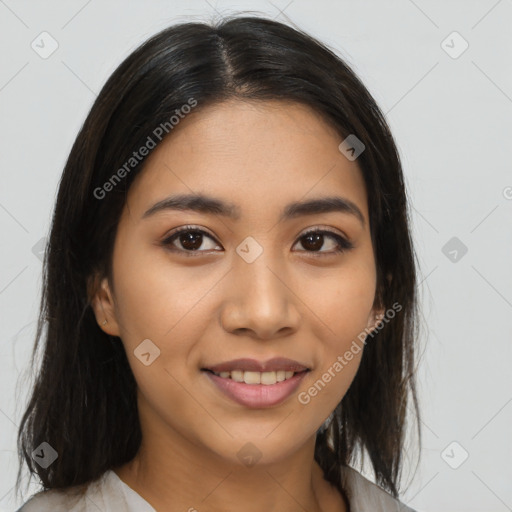 Joyful latino young-adult female with long  brown hair and brown eyes