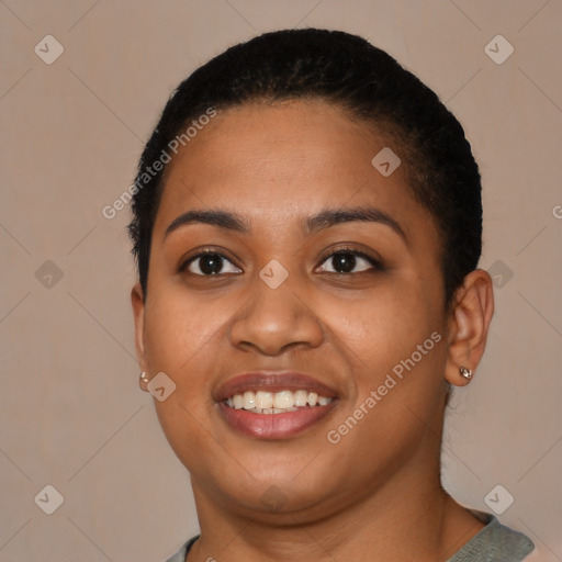 Joyful latino young-adult female with short  black hair and brown eyes