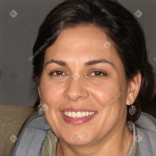 Joyful white adult female with long  brown hair and brown eyes