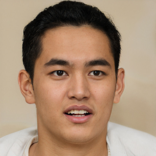 Joyful latino young-adult male with short  brown hair and brown eyes