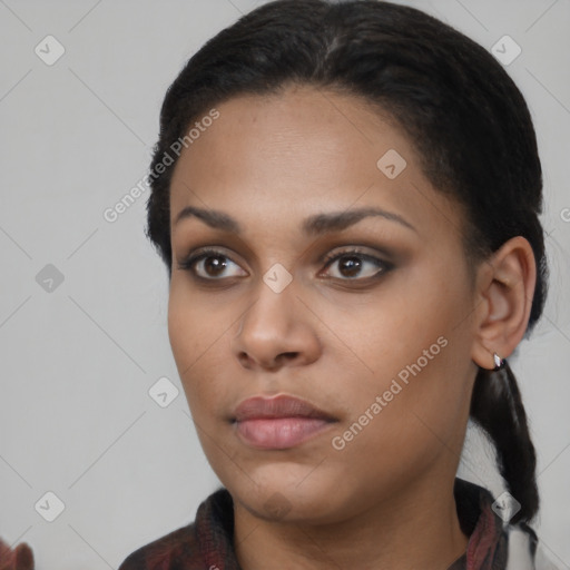 Neutral black young-adult female with long  black hair and brown eyes