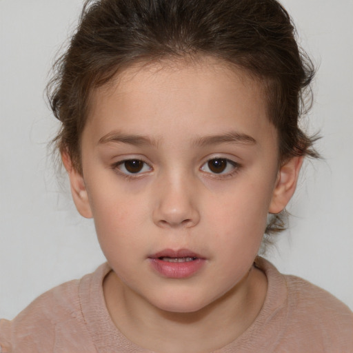 Neutral white child female with short  brown hair and brown eyes