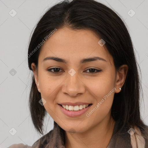 Joyful latino young-adult female with long  brown hair and brown eyes