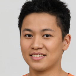 Joyful asian young-adult male with short  brown hair and brown eyes