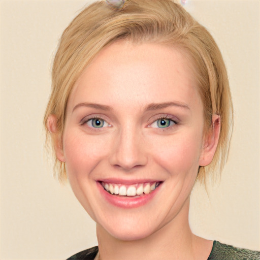 Joyful white young-adult female with medium  brown hair and blue eyes