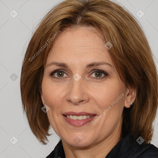 Joyful white adult female with medium  brown hair and brown eyes