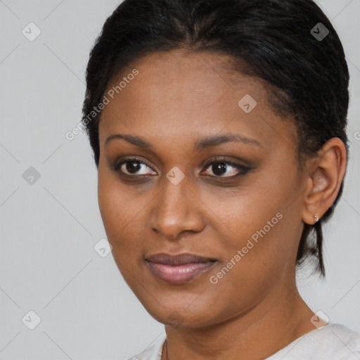 Joyful black young-adult female with short  brown hair and brown eyes