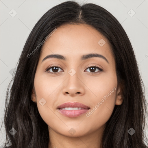 Joyful latino young-adult female with long  black hair and brown eyes