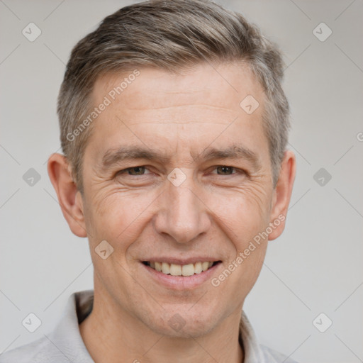 Joyful white adult male with short  brown hair and brown eyes