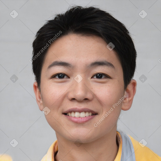 Joyful asian young-adult male with short  brown hair and brown eyes