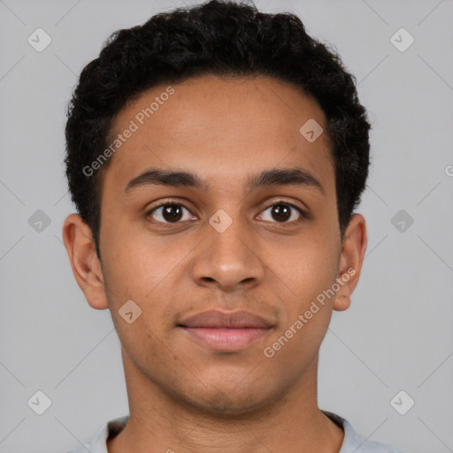 Joyful latino young-adult male with short  brown hair and brown eyes