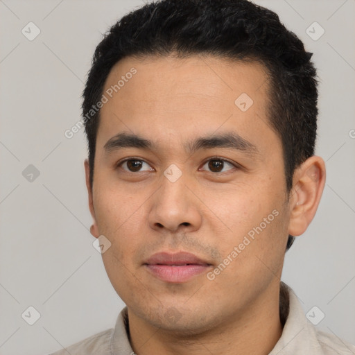 Neutral latino young-adult male with short  black hair and brown eyes