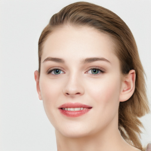 Joyful white young-adult female with long  brown hair and grey eyes