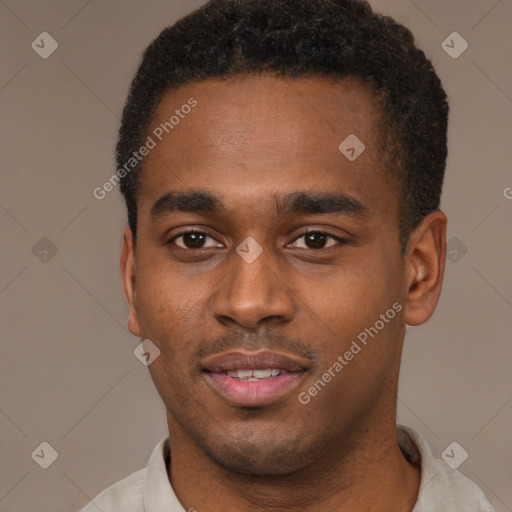 Joyful black young-adult male with short  brown hair and brown eyes