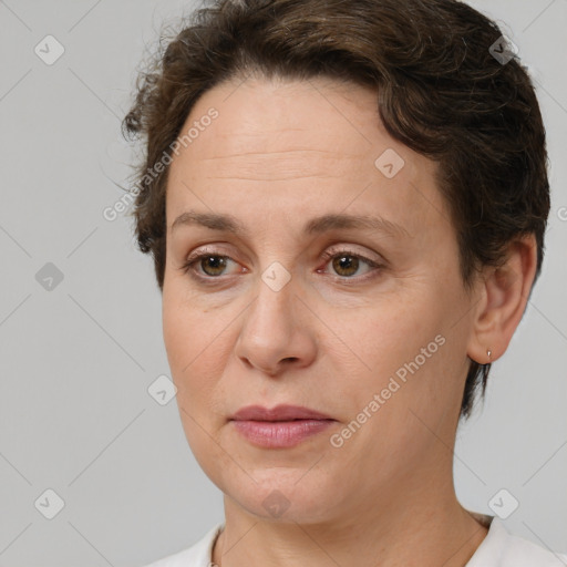 Joyful white adult female with short  brown hair and brown eyes