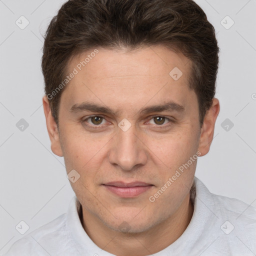 Joyful white adult male with short  brown hair and brown eyes