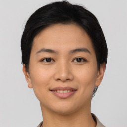 Joyful asian young-adult female with short  brown hair and brown eyes