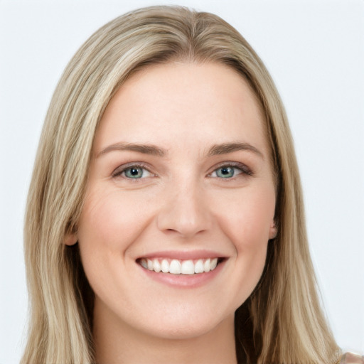 Joyful white young-adult female with long  brown hair and green eyes