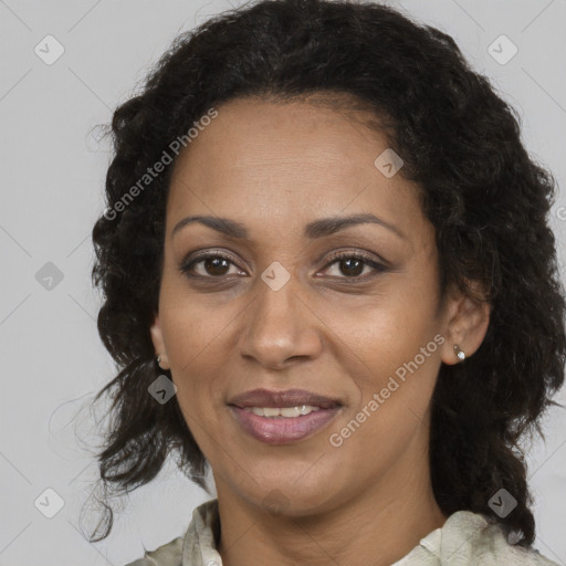 Joyful black adult female with medium  brown hair and brown eyes