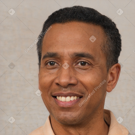 Joyful latino adult male with short  black hair and brown eyes