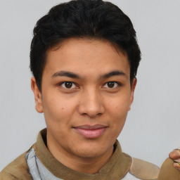 Joyful latino young-adult male with short  brown hair and brown eyes