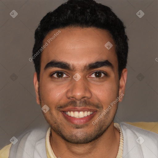 Joyful white young-adult male with short  black hair and brown eyes