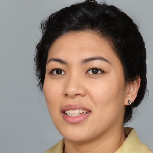 Joyful asian young-adult female with medium  brown hair and brown eyes