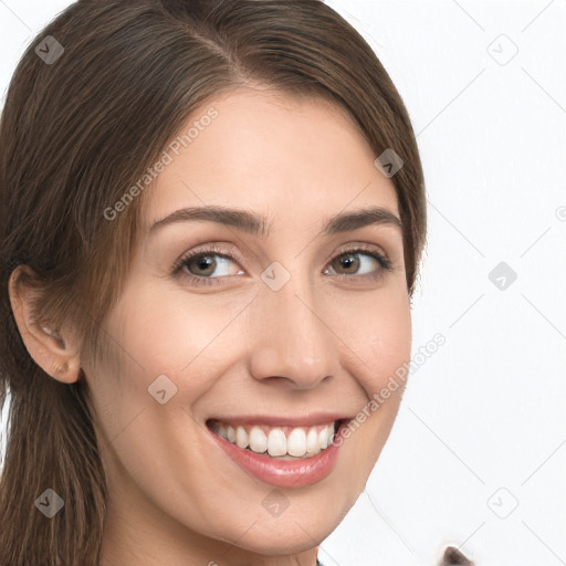 Joyful white young-adult female with long  brown hair and brown eyes