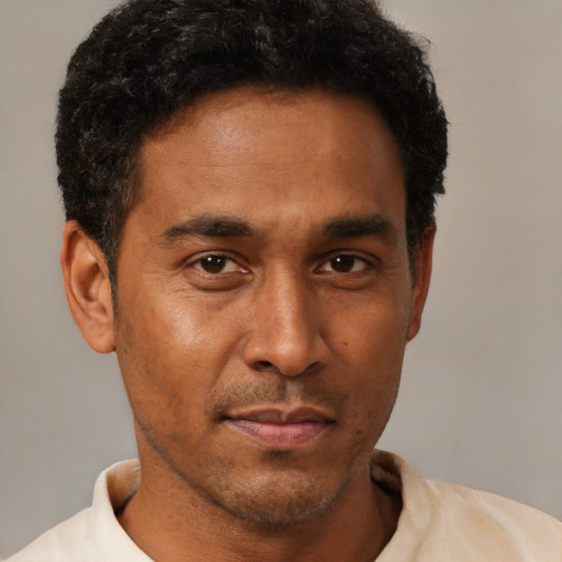 Neutral latino young-adult male with short  brown hair and brown eyes