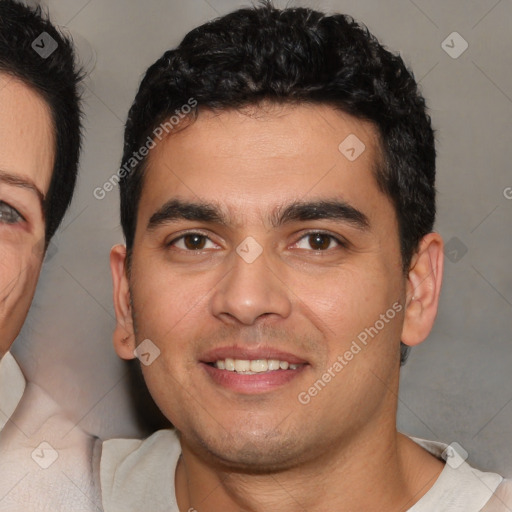 Joyful white young-adult male with short  black hair and brown eyes