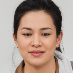 Joyful asian young-adult female with medium  brown hair and brown eyes