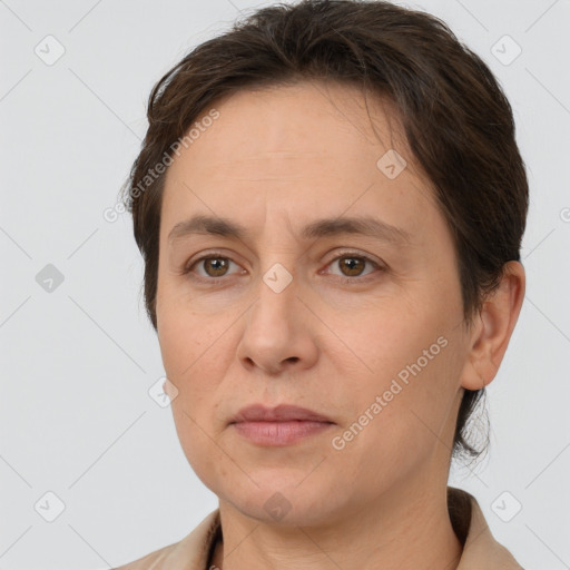 Joyful white adult female with short  brown hair and brown eyes