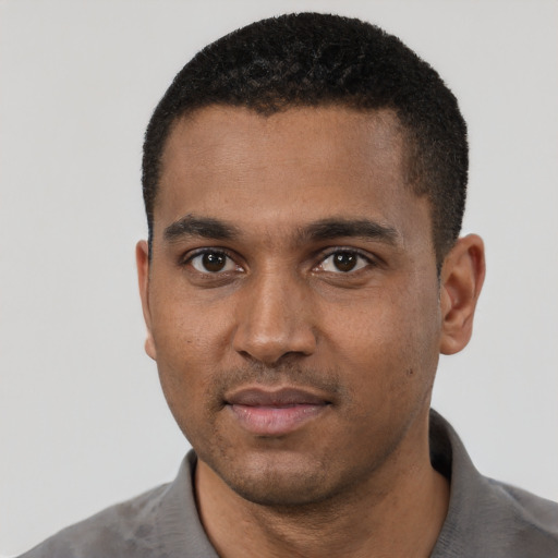 Neutral black young-adult male with short  black hair and brown eyes