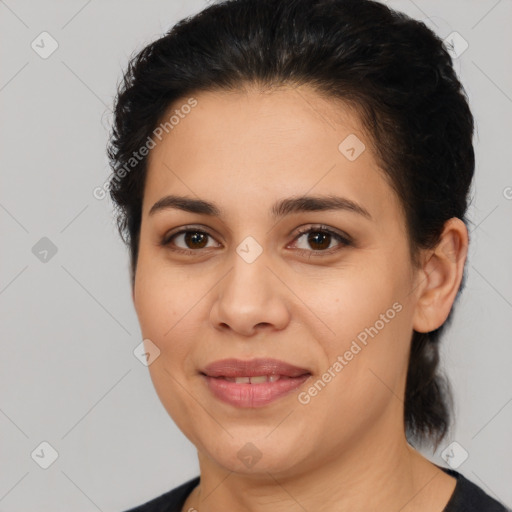 Joyful latino young-adult female with medium  brown hair and brown eyes