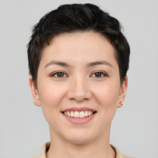 Joyful white young-adult female with short  brown hair and brown eyes