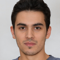 Neutral white young-adult male with short  black hair and brown eyes