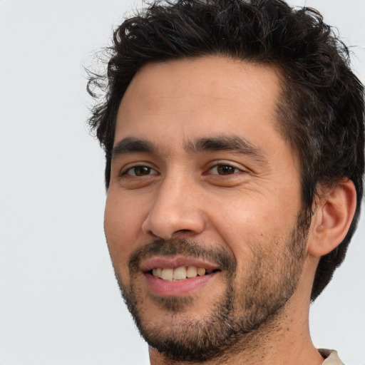 Joyful white young-adult male with short  black hair and brown eyes