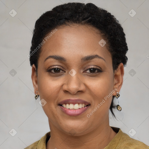 Joyful black young-adult female with short  brown hair and brown eyes