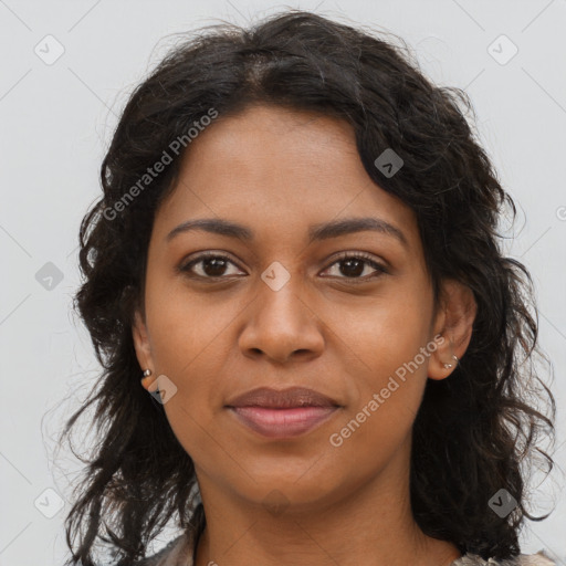 Joyful black young-adult female with long  brown hair and brown eyes